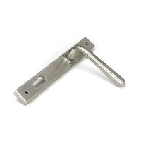 The Slimline Lever Espagnolette Door Handle Set in Satin Stainless Steel Shown Resting on its Side on a White Background