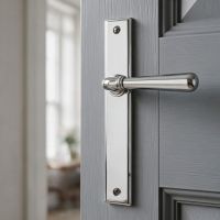 The Slimline Smooth Lever Espagnolette Door Latch in Polished Chrome on a Grey Door in a Luxury Home - Digital Illustration