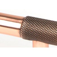 The Small Half Knurled Cabinet Pull Handle in Polished Bronze Looking Close up of the Smooth Grip on the Central Bar The Small Half Knurled Cabinet Pull Handle in Polished Bronze Looking Close up of the Smooth Grip on the Central Bar