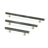 The Small Knurled Cabinet Pull Handle in Pewter Shown Alongside Other Sizes on a White Background