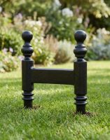 The Smithers Cast Iron Victorian Boot Scraper Positioned on a Garden Lawn - Digital Illustration