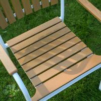 The Solis Round 4-Seater Outdoor Dining Set in White Showing the Slatted Seat on the Chair