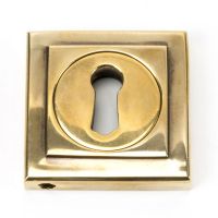 The Square Concealed Standard Keyhole Escutcheon - Aged Brass on a White Background The Square Concealed Standard Keyhole Escutcheon - Aged Brass on a White Background