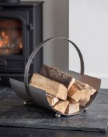 The Steel Curved Log Carrier on a Black Stone Hearth next to a Log Burner Stove - Digital Illustration
