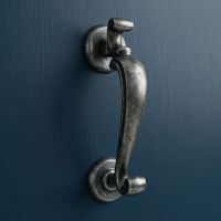 The Steel Pewter Doctor"s Style Door Knocker on a Navy Blue Door on the Front of a Home - Digital Illustration The Steel Pewter Doctor"s Style Door Knocker on a Navy Blue Door on the Front of a Home - Digital Illustration