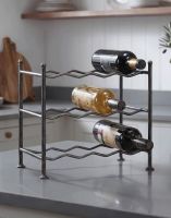 The Steel Three Tier Wine Rack on a Grey Kitchen Countertop in a Modern Home - Digital Illustration The Steel Three Tier Wine Rack on a Grey Kitchen Countertop in a Modern Home - Digital Illustration