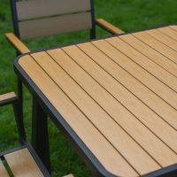The Strata Slatted 4-Seater Outdoor Dining Set in Black Showing the Wood Effect Table Top Panelling