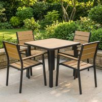 The Strata Slatted 4-Seater Outdoor Dining Set in Black Shown in a Sunny Low Walled Garden - Digital Illustration