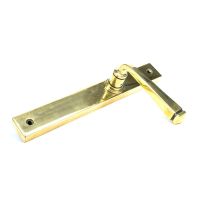The Tapered Slimline Lever Espagnolette Door Latch in Aged Brass Shown on its Side The Tapered Slimline Lever Espagnolette Door Latch in Aged Brass Shown on its Side