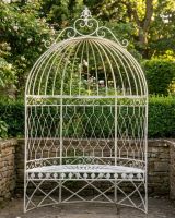 The Taylor Arched Dome Canopy Bench in Cream Displayed in a Low Walled Garden - Digital Illustration 