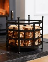 The Traditional Black "Basket" Log Holder in Front of a Lit Log Burner Stove in a Modern Home Interior - Digital Illustration The Traditional Black "Basket" Log Holder in Front of a Lit Log Burner Stove in a Modern Home Interior - Digital Illustration