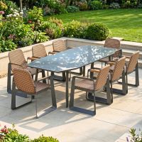 The Tribeca Weave 8-Piece Patio Dining Set Shown on a Sunny Garden Patio in a Low Walled Garden
