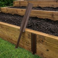 The Triple Brown Railway Sleeper Straight Inline Spikes in Brown next to a Raised Flower Bed - Digital Illustration 