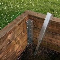 The Triple Stainless Steel Railway Sleeper Corner Spikes on a Raised Garden Bed - Digital Illustration