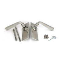 The Valen Lever Latch Door Handle Set in Satin Stainless Steel Shown With Supplied Parts including Spindles and Screws