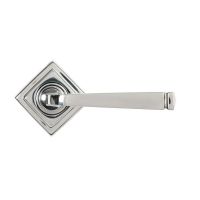 The Valen Tapered Sprung Handle Set on a Square Rose in Polished Stainless Steel Shown with the Backplate in a Diamond Orientation on a White Background