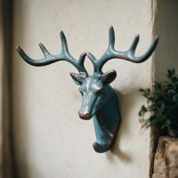 The Verdigris Stag Hook Mounted on a Cream Wall in a Well Lit Interior - Digital Illustration The Verdigris Stag Hook Mounted on a Cream Wall in a Well Lit Interior - Digital Illustration