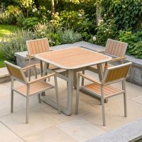 The Verve Quadrat 4 in Seater Outdoor Dining Set in Champagne in a Low Walled Garden on a Sunny Afternoon