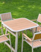 The Verve Quadrat 4 in Seater Outdoor Dining Set in Champagne Showing the Wood Effect Table Top Panelling