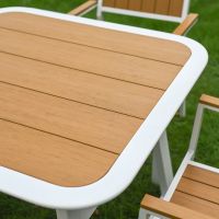 The Verve Quadrat 4 in Seater Outdoor Dining Set in White Showing the Wood Effect Table Top