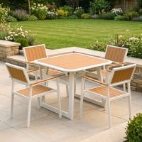 The Verve Quadrat 4 in Seater Outdoor Dining Set in White Shown in a Modern Garden Setting on a Patio