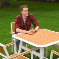 The Verve Quadrat 4 in Seater Outdoor Dining Set in White With a Close up of a Man Sat at the Table
