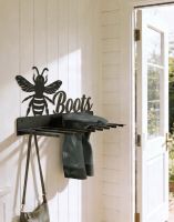 The Wall Mounted Bumble Bee Iron Boot Holder Fixed Inside a Cream Coloured Wooden Porch - Digital Illustration 