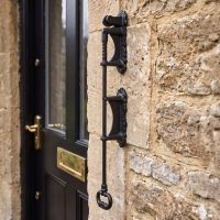 The “Welling Hall” “Butler” door bell pull on the Front of a Stone The “Welling Hall” “Butler” door bell pull on the Front of a Stone