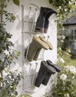The Winsbury Cream Wall Mounted 6 Pair Boot Rack Fixed to a Sunny Garden Exterior Wall - Digital Illustration The Winsbury Cream Wall Mounted 6 Pair Boot Rack Fixed to a Sunny Garden Exterior Wall - Digital Illustration