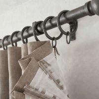 The Wrought Iron Curtain Ring Fitted on a Matching Curtain Rail Pole in a Modern Home - Digital Illustration