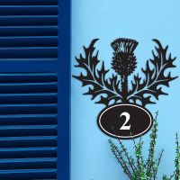 Thistle Iron House Number Sign in Situ on a Blue Wall