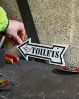 Scale image of Toilets Arrow Vintage Style Cast Iron Sign