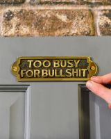 Scale Shot Humorous Brass and Black Sign Scale Shot Humorous Brass and Black Sign