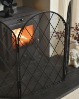 Side Of The Ornate Iron Fire Guard Side Of The Ornate Iron Fire Guard