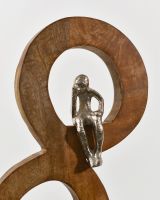 Close up of top silver cast aluminium figure on interior ornament