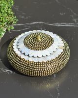 Top view of brass and pealescent scalloped edge trinket bowl