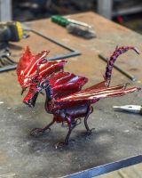 View of dragon wings on recycled metal sculpture