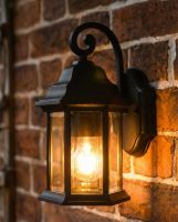 Digital representation of Traditional Black Aluminium Ornate Top Fix Wall Lantern lit up