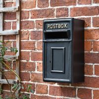 Traditional Black & Gold Wall Mounted Post Box Mounted on a Brick Wall Traditional Black & Gold Wall Mounted Post Box Mounted on a Brick Wall