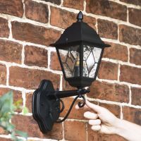 Scale Shot of Traditional Black Victorian Outdoor Wall Lantern with Ornate Bracket Scale Shot of Traditional Black Victorian Outdoor Wall Lantern with Ornate Bracket