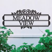 Traditional Foliage House Name Sign in Situ on a White Wall