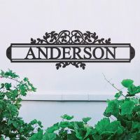 Traditional Foliage House Name Sign in Situ on a White Wall