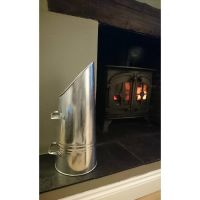 Traditional Coal Hod Next to the fire Place