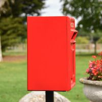 Situ Shot of Traditional Red & Gold Post Box and Stand