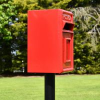 View of the Side of the Traditional Red & Gold Post Box and Stand