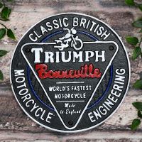 "Classic British Triumph Motorcycles" Cast Iron Vintage Wall Sign on a Brick Wall "Classic British Triumph Motorcycles" Cast Iron Vintage Wall Sign on a Brick Wall