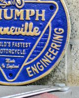 Close up of handpainted cast iron sign