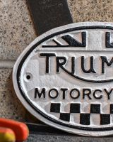 Close up of Triumph Vintage Style Cast Iron Sign finish