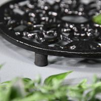 Close-up of the feet on the Black Heavy Duty Cast Iron Round Trivet