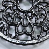 Ornate Design on the Black Heavy Duty Cast Iron Round Trivet